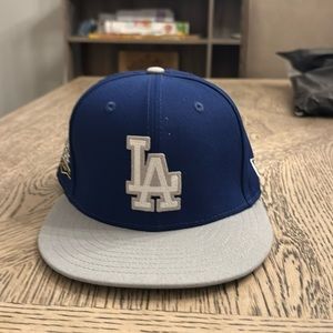 Brand new, never worn LA Dodgers hat. Downsizing my collection. Size 7.